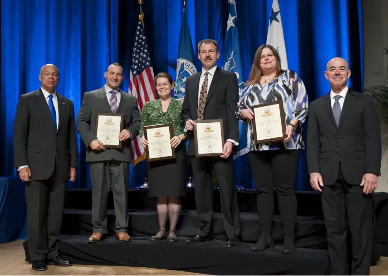 Secretary of Homeland Security Jeh Johnson and Deputy Secretary of Homeland Security Alejandro Mayorkas presented the Secretary's Customer Service Award to U.S. Citizenship and Immigration Services Enhanced I-9 Form Team members