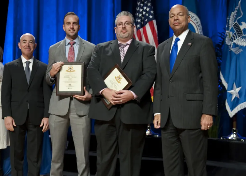 Secretary of Homeland Security Jeh Johnson and Deputy Secretary of Homeland Security Alejandro Mayorkas presented the Secretary's Customer Service Award to Office of Privacy's eFOIA Mobile Application Team members Michael Norman, Christopher Drew, Douglas Hansen and David Lindner