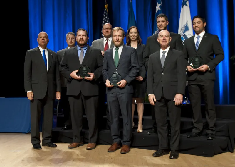 Secretary of Homeland Security Jeh Johnson and Deputy Secretary of Homeland Security Alejandro Mayorkas presented the Secretary's Unit Award to members of the U.S. Immigration and Customs Enforcement Counterintelligence Team Christopher R. Pascua, Jason A. Axley, Jessica L. Nelson, Carlos L. Romero, Errol B. Van Ommeren, Sean R. Sullivan, and Brian M. Hahn.