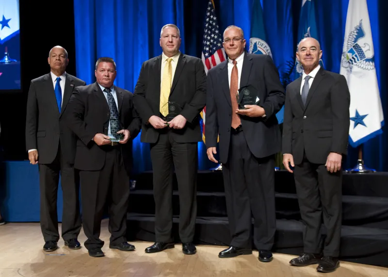 Secretary of Homeland Security Jeh Johnson and Deputy Secretary of Homeland Security Alejandro Mayorkas presented the Secretary's Unit Award to members of the U.S. Immigration and Customs Enforcement Insider Threat Group Michael G. Tirrell, Joseph Arnold, and Richard Balfour, during the Secretary's Award Ceremony held Oct. 26, 2016.