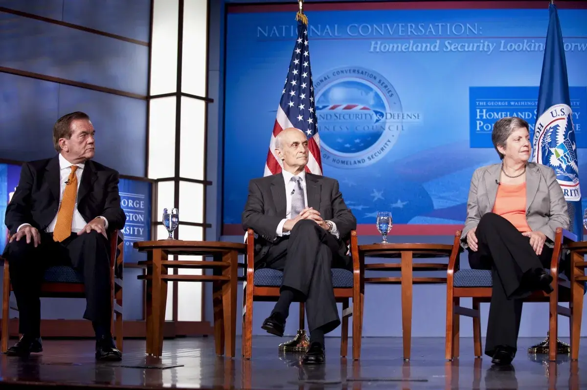 The three previous DHS Secretaries sitting with each other, from left to right: Tom Ridge, Michael Chertoff, and Janet Napolitano.